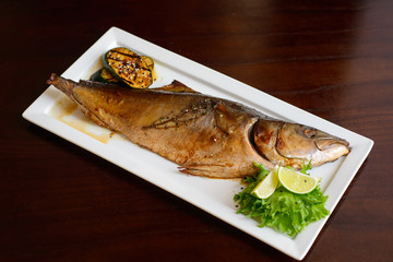 grilled tuna on a white plate served.