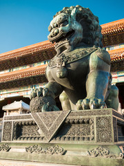 Lions closeup on Tiananmen Square near Gate of Heavenly Peace- the entrance to the Palace Museum in Beijing (Gugun) against the clear and blue sky