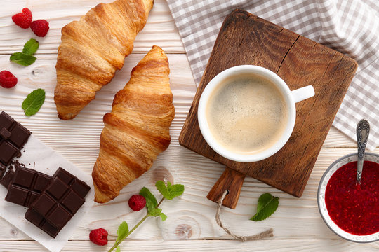 Americano coffee with croissants and jam