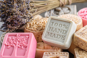 set of handmade soaps with lavender bunch, product of cosmetics and body care - obrazy, fototapety, plakaty