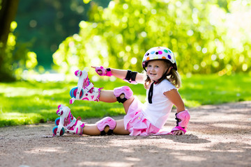 Little girl with roller skate shoes in a park