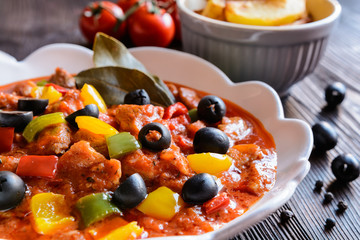 Pork Ragu with pepper, olives and fried potatoes