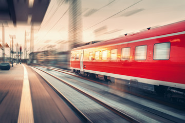 Fototapeta na wymiar Modern high speed red passenger commuter train. Railway station