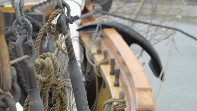 The metals and the ropes on the ship vessel that is docking on the port