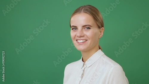 "Close up young woman in white shirt turning the head