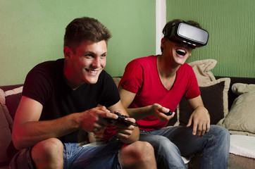 Charming beautiful brothers playing video games together
