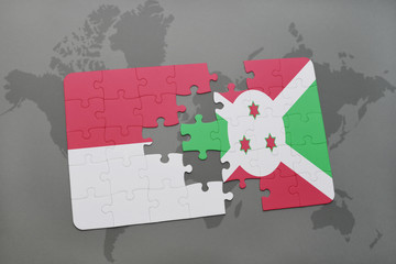 puzzle with the national flag of indonesia and burundi on a world map background.