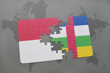 puzzle with the national flag of indonesia and central african republic on a world map background.