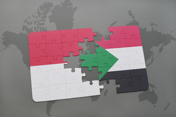 puzzle with the national flag of indonesia and sudan on a world map background.