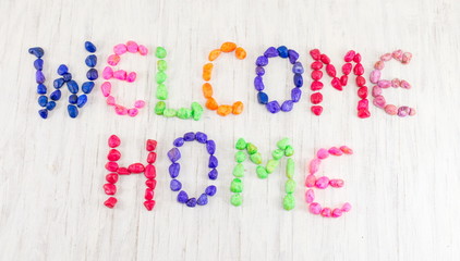 Welcome home note written with small rocks
