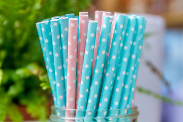 Colorful paper straws for birthday party on natural background