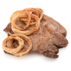 Cooked fried pork meat with onion slices garnish isolated on whi