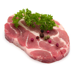 Raw pork neck chop meat with parsley herb leaves and peppercorn