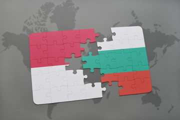 puzzle with the national flag of indonesia and bulgaria on a world map background.