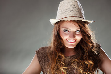 Mysterious enigmatic intriguing woman girl in hat.