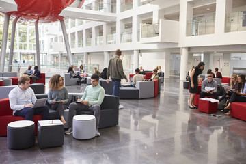 Students socialising in the lobby of modern university