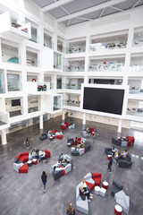 Modern university lobby atrium and study rooms, vertical - obrazy, fototapety, plakaty