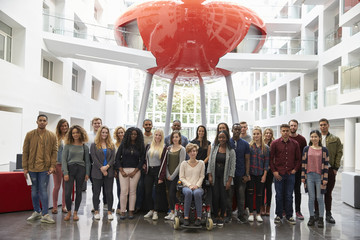 Students in modern university building, large group portrait