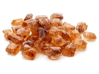 Brown caramelized lump cane sugar cube isolated on white backgro