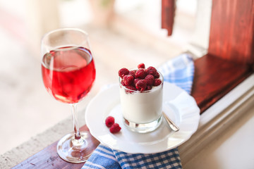 healthy breakfast : yogurt, glass of juice and fresh raspberries