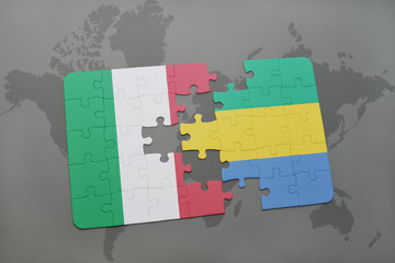 puzzle with the national flag of italy and gabon on a world map background.