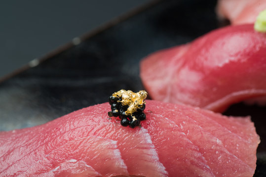 golden leaf and caviar on fattty blue fin tuna sushi