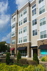 Modern apartment complex exterior with landscaping
