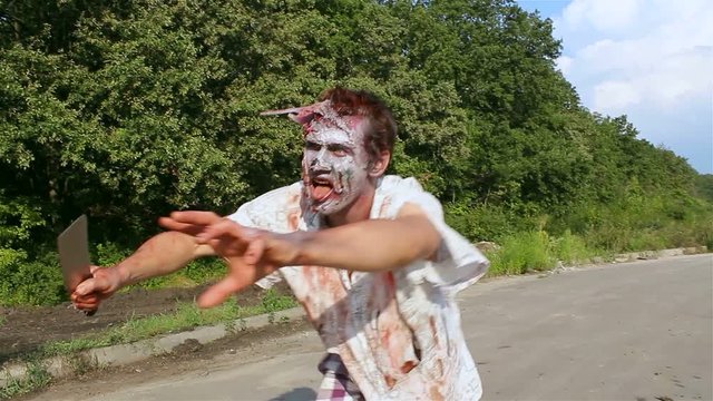 horrible zombie goes through the woods for prey