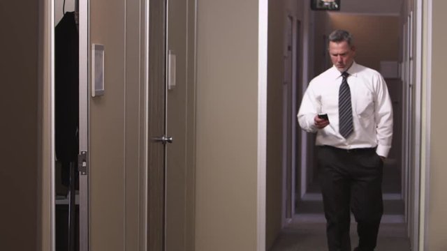 Office workers walking through hallway