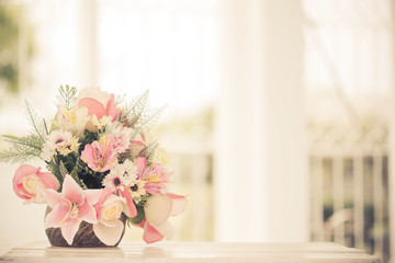 decorative flowers on the table , warm tone color use for backgr