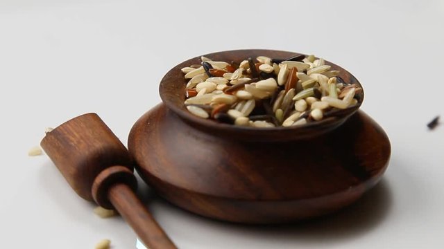 Wild rice rotating in a wooden container