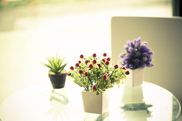 decorative flowers on the table , warm tone color use for backgr