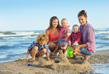 Two Womans with children on the beach