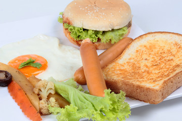 American breakfast with meat cheeseburger  at home on white background.