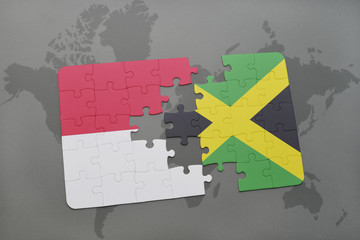 puzzle with the national flag of indonesia and jamaica on a world map background.