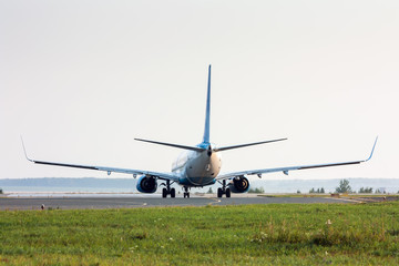 Airplane turns on Runway. Back view