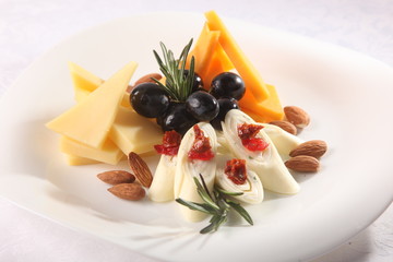 cheese plate with olives and nuts