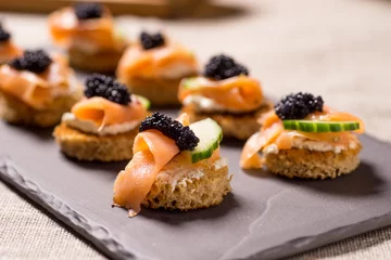 Papier peint adhésif Entrée Smoked Salmon Canapes with Sour Cream and Caviar