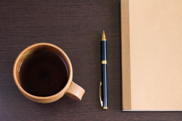 Notebook and pen and coffee