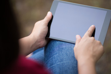Woman Use Tablet at Park