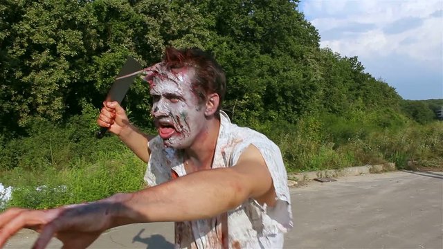 horrible zombie, walking along the road for the victim