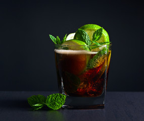  cocktail Cuba libre with lime and peppermint leaves