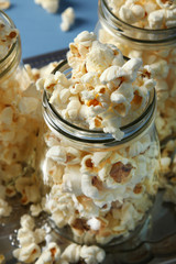 Popcorn in glass jars on the tray