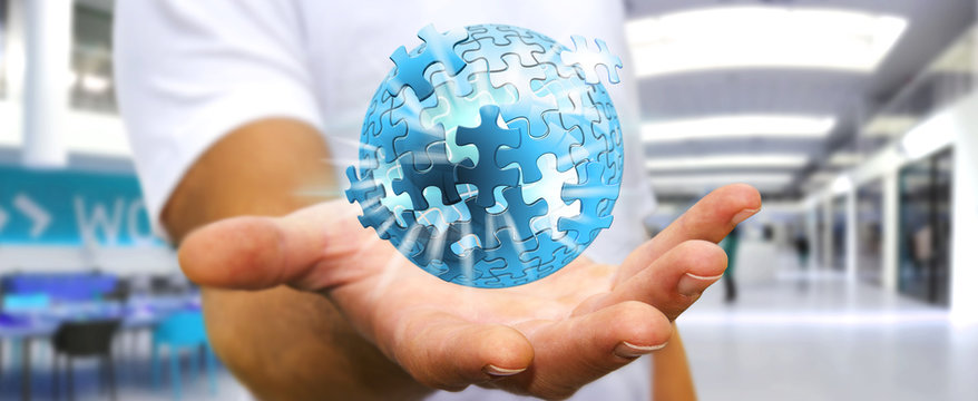 Businessman holding flying puzzle sphere ‘3D rendering’
