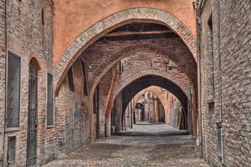 Fototapeta na wymiar Ferrara, Italy, the medieval alley Via delle Volte
