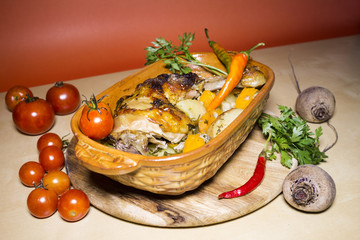 Grilled chicken legs with potatoes and vegetables