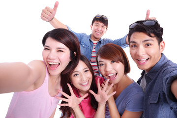  teenagers taking pictures by themselves