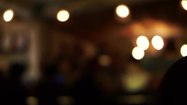 Video of people enjoying night life at blur night bar with bokeh light