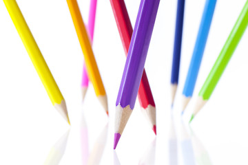 Vertical positioning color pencils on white background