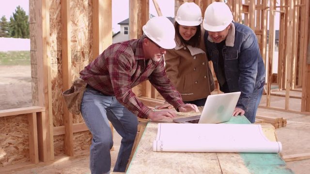 Couple speaking to contractor